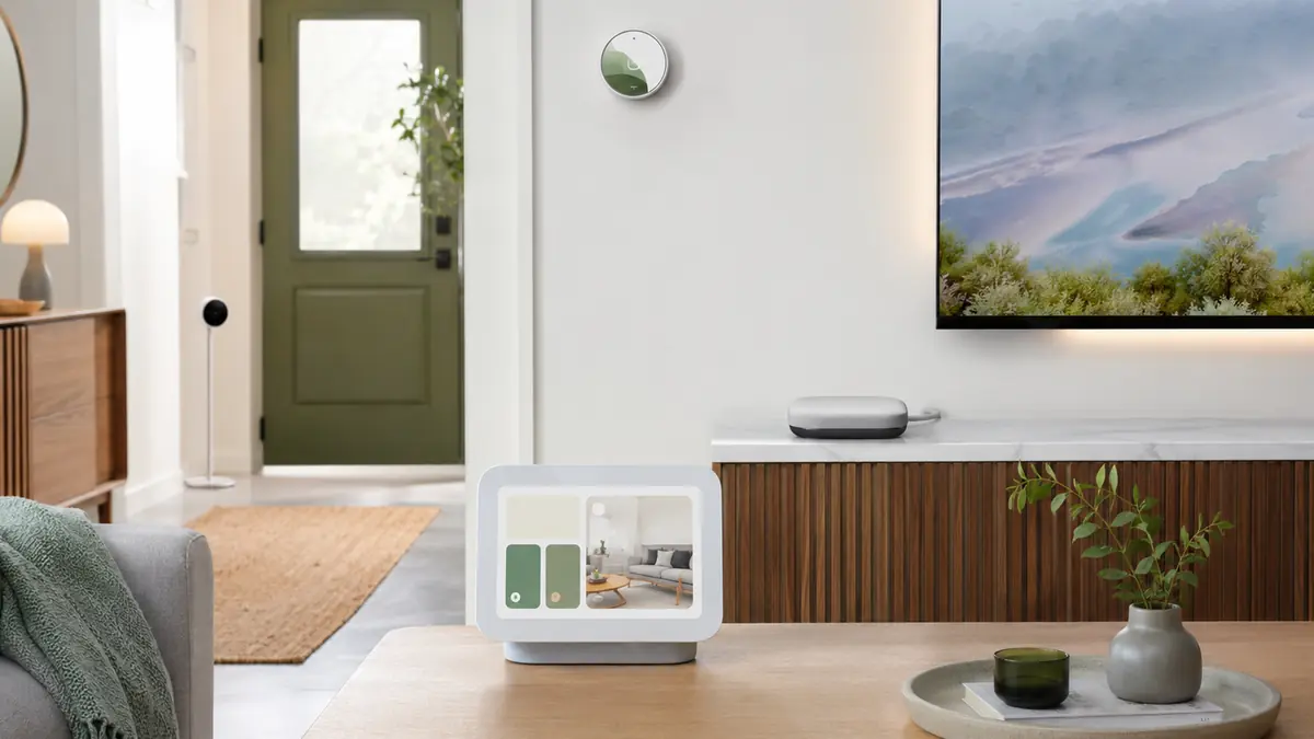 Google Home style smart display, streaming hub, camera and thermostat in a modern home