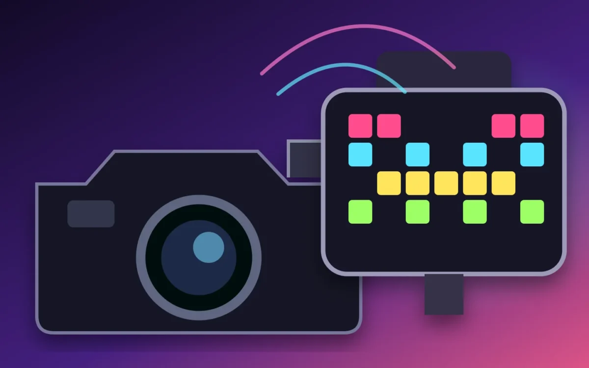 Tiny magnetic pixel display mounted on a camera beside colorful grouped studio lights