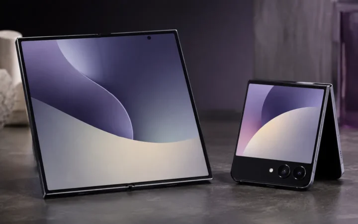 Editorial visualization of book-style and clamshell foldable smartphones on a blue studio surface