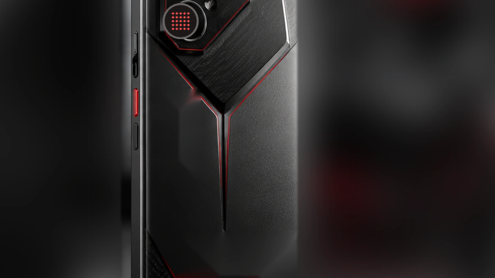 Black and red special-edition gaming smartphone in a dark premium desk environment with red ambient lighting.